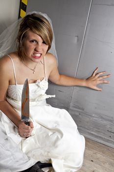 angry young bride with a bloody knife in an elevator