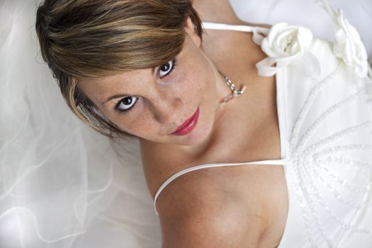 beautiful young bride in a wedding dress with a veil