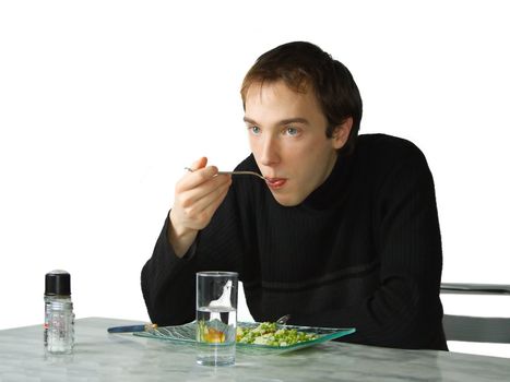 Young man eating, isolated over white