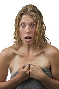 Closeup on blond woman with curly hair who's surprised while getting out of the shower, and grabs her towel.