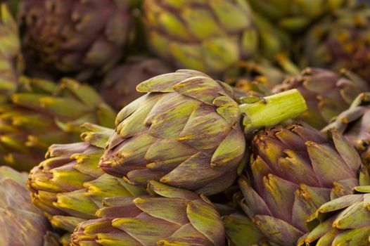 Pile of Artichokes Vertical at the farmers market