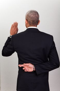 Businessman Taking Oath With Crossed Fingers. Dishonesty concept