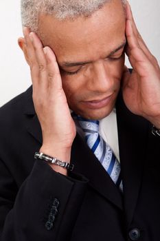 Stressed Businessman Man With Headache and holding his head