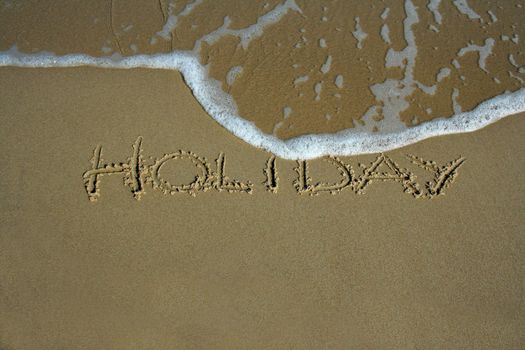 holiday inscription on the beach