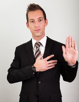 Success Man With Arm On Chest Taking Oath