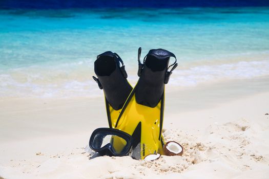 snorekl equipment on white sand beach at Maldives