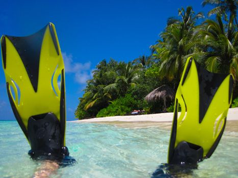 snorekl equipment on white sand beach at Maldives