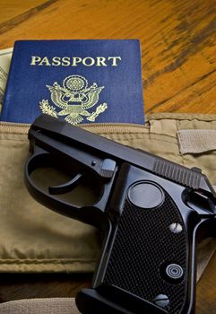 Handgun with passport.  Undercover/007 theme.
