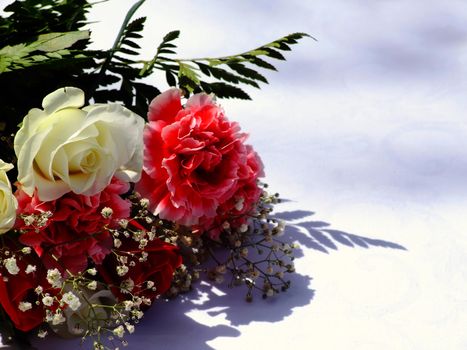 Detail of wedding flowers lying on table during ceremony