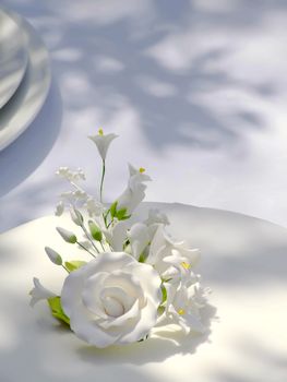 Floral arrangement on wedding cake made out of sweets