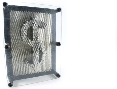 Wide angle shot of a pin toy forming the shape of the dollar (currency symbol).