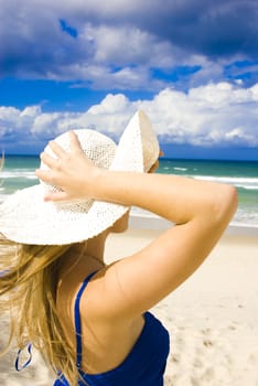 pretty young girl at the beach in summer