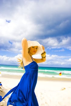 pretty young girl at the beach in summer