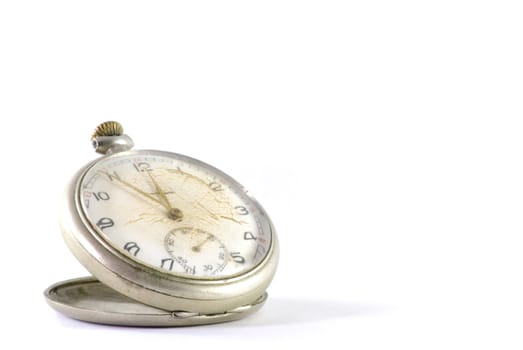 Old pocket clock with glass cracked. Isolated on white