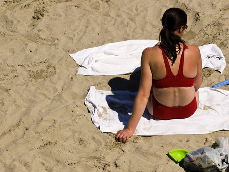 Woman in bikini at the beach in spring in Malta