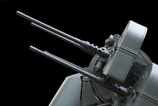 Side shot of an Anti-Aircraft Machine Gun. Isolated on black with path.