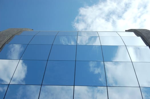 office building. sky and clouds reflection