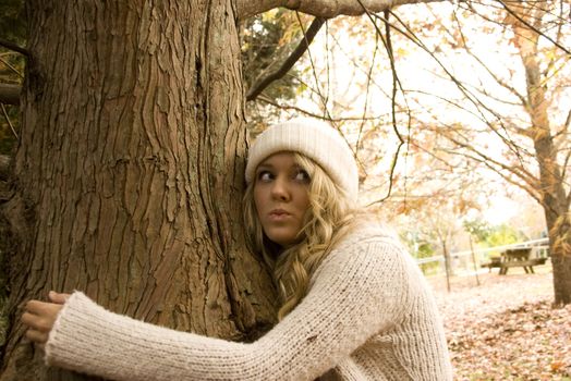 hugging a tree in the park