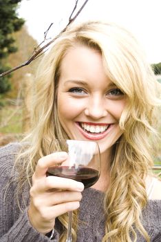 woman drinking wine at the vineyard