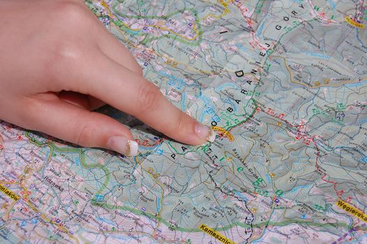 woman's finger on the map