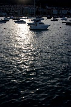 image of some boats resting in a calm sea