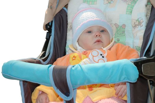 Little girl in bright clothes sit in carriage.