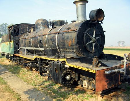 An antique train engine in India.