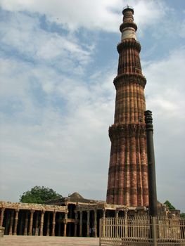 Qutab Minar (tower) and the Iron Pole in New Delhi, India.