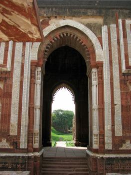 Looking through the arches at Qutab Minar in New Delhi, India.