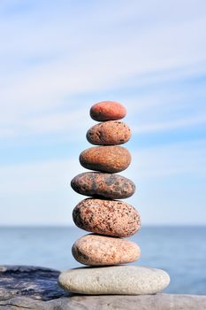 Different amounts of colored pebble as the pyramid