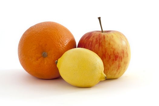 orange, lemon and apple on a white background