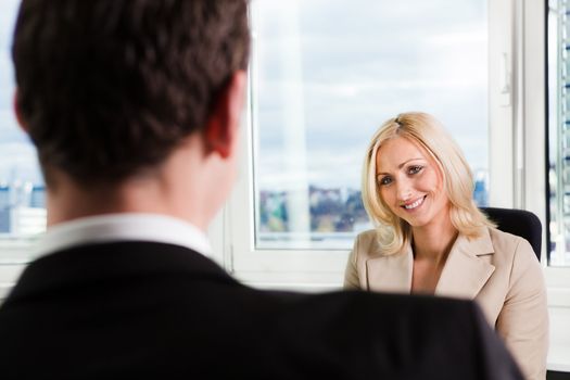 Two businesspeople at an interview in the office