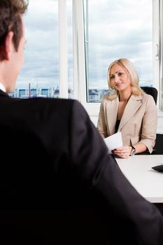 Two businesspeople at an interview in the office