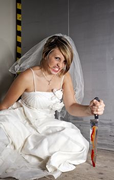 angry young bride with a bloody knife in an elevator