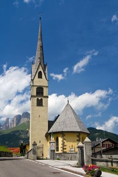 small church in Alba di Canazei, Trentino, Italy. Canazei is a famuos small town in val di Fassa, Italian dolomites. Photo taken with polarized filter