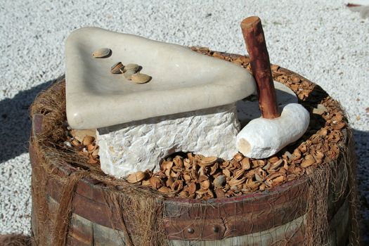 old nut cracker made with stone and wood