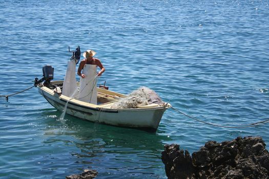 fisherman on the coast of adriatic see