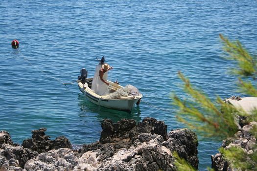 fisherman on the coast of adriatic see