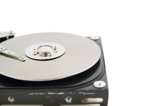Close-up of the opened hard disc drive on the white background