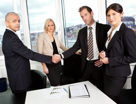 Business handshake over the deal at office
