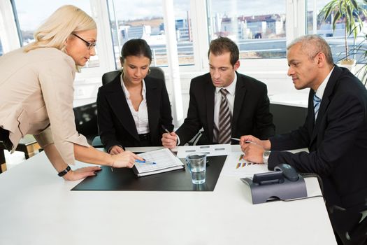 Women giving instructions to the business team