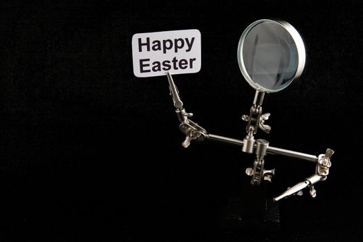 figure of steel man with "Happy Easter" inscription on black background