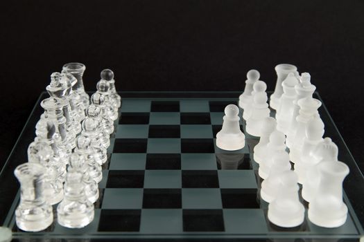 glass chess on the transparent chessboard