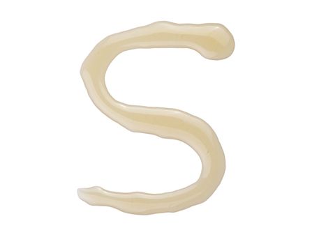 A letter S written with honey.