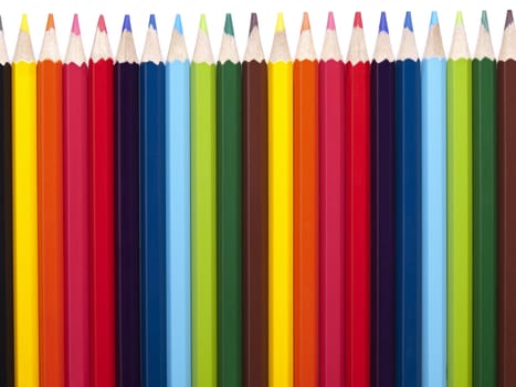 Several colored pencils in a straight row.