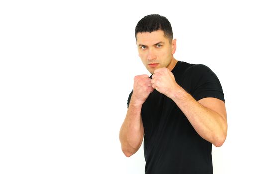 A portrait of a Caucasian man in ready to fight position isolated over white background