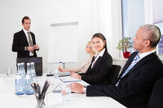 Businessman giving a presentation to his colleagues