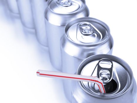 Top view of a row of soda cans.