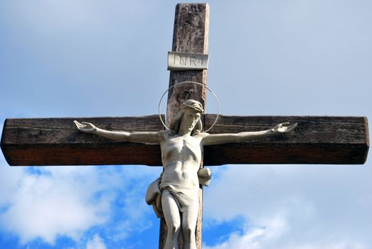 Jesus Christ Crusifix Statue In Blue Sky