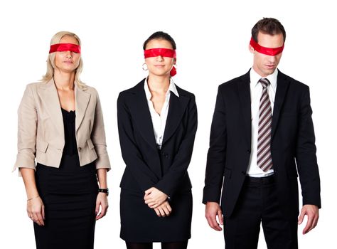 Group of disoriented businesspeople with red ribbons on eyes